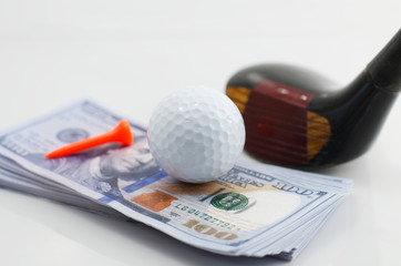 Golf ball and dollars, is the world's number one business