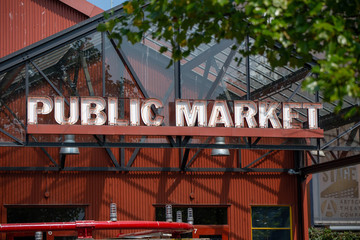 Public market neon sign in the street under the sun