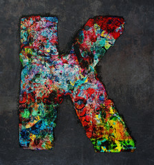 wooden letters A   graffiti style on a dark textured background