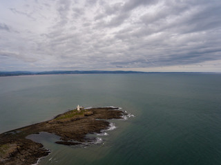 Fototapeta premium An aerial view of the Mumbles coastline in Swansea, South Wales, UK