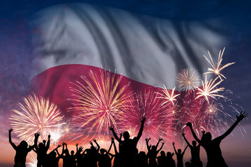 People are looking on fireworks and flag of Poland