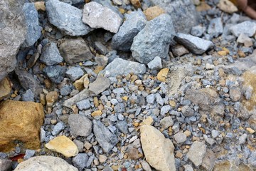 The rocks and stones texture on the ground.
