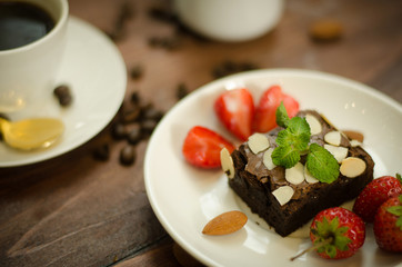 Chocolate brownie, strawberry and coffee with casual day