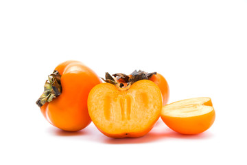 Delicious fresh persimmon fruit isolated on white background.