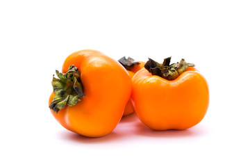 Delicious fresh persimmon fruit isolated on white background.