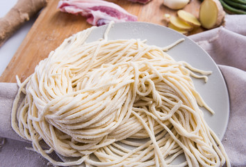 Chinese pasta, fresh noodles and meat, and other vegetables