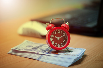 alarm clock and money