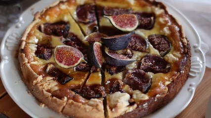 Delicious Tart With Fresh Figs And Goat Cheese On Rustic Wooden Table - Powered by Adobe