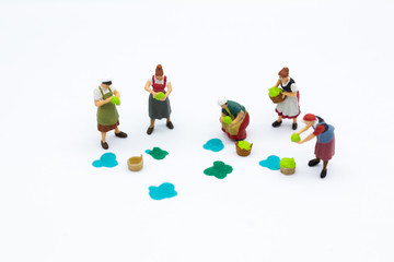 Miniature people: Gardeners and the results of agriculture, vegetables. Image use for distribution to the market.