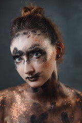 Halloween make up. Portrait pale gothic daemon woman.