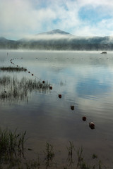 Foggy morning view of Webb Lake from Mt. Blue State Park campground