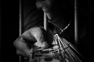 Male prisoner handcuffed to the dollar as evidence of the case
