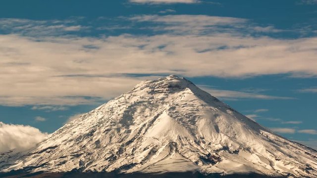 Cotopaxi Volcano after a heavy snowfall. Situated in the Ecuadorian Andes, at 5897m is one of the worlds highest volcanoes. Vapour is emanating from fumaroles near the summit.