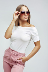 Fashion portrait of a young woman in sunglasses