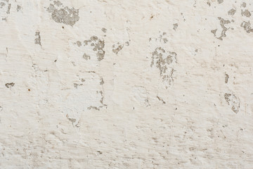 Fototapeta premium Wall fragment with scratches and cracks. It can be used as a background