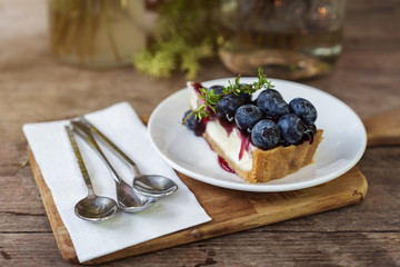 blueberry cheese cake on wooden table
