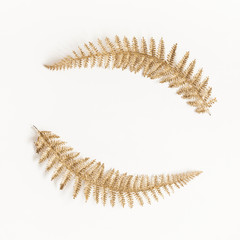 Christmas composition. Wreath made of golden decorations on white background. Christmas, winter, new year concept. Flat lay, top view, copy space, square