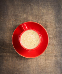 cup of coffee on dark wooden background