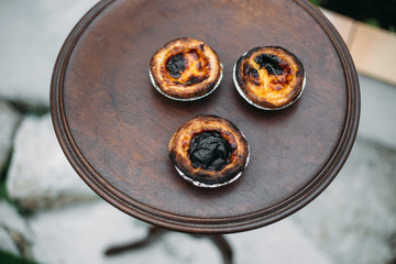 Pastel de nata. traditional Portuguese cake on old wooden rustic table