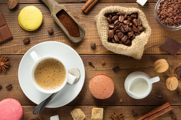 cup of coffee and ingredients with beans