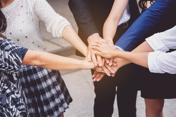 Group Many business people join hands to demonstrate harmony. The determination to work...