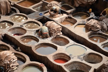 Obraz na płótnie Canvas Busy day at Chaouara Tanneries in Fez, Morocco,