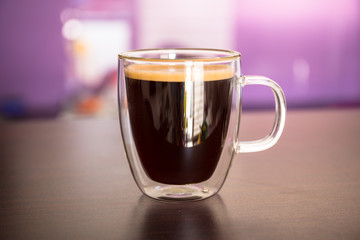 Cup of black coffee on the table
