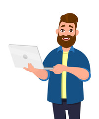Young handsome man holding laptop computer and smiling while standing. Laptop computer concept illustration. Vector illustration in cartoon style.