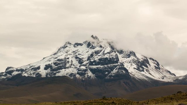Sincholagua Volcano after a heavy snowfall. Now only occasionally has snow, the glaciers melted decades ago, Situated in the Ecuadorian Andes south of Quito in Cotopaxi National Park, 4,899m altitude.