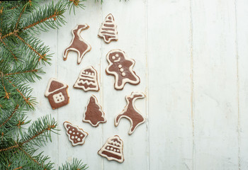 Christmas background on white wooden boards with biscuits and gifts,Christmas cookies