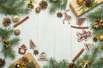Fototapeta na wymiar Christmas background on white wooden boards with biscuits and gifts,Christmas cookies