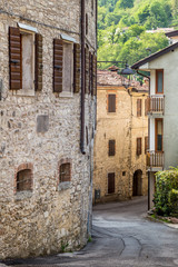 Fototapeta na wymiar Valdobbiadene region of Prosecco sparkling wine, vineyards planted with steep slopes of hills. Combai village, Italy