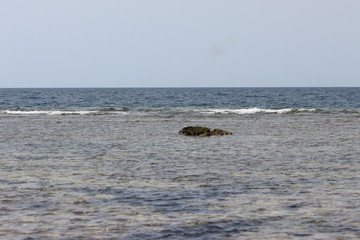 Fototapeta premium rock on the middle of the sea