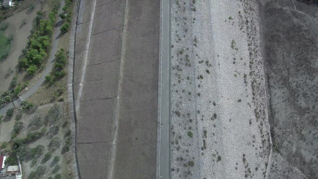 Aerial top shot above a dam or dyke
