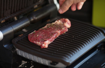roast meat on electrical roaster close up