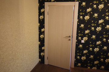 The interior of a room installed with a new interior. door.The installed door harmoniously complements the interior of the room, bathroom or toilet