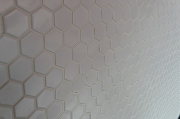 A simple white texture pattern of hexagons as a background