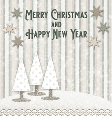 Christmas and New Year greeting card with tree Christmas trees in a snowy landscape