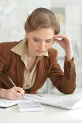 Portrait of young businesswoman working in office