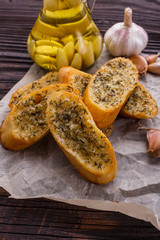 fragrant garlic bread on a rustic wooden background