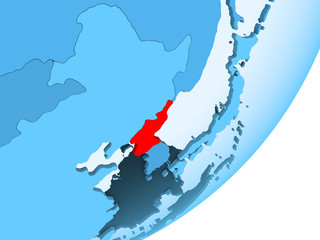 Map of North Korea on blue political globe