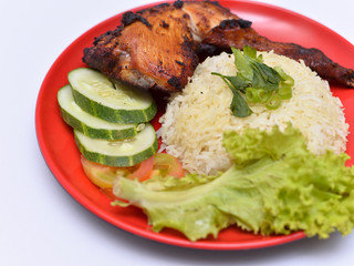 a set of a plate of chicken rice