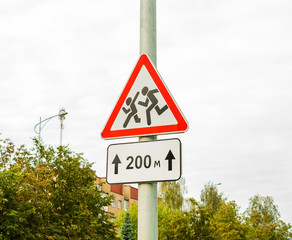 Road sign cautiously children, school. Watch out for Children