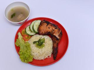 a set of a plate of chicken rice