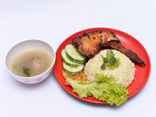 a set of a plate of chicken rice