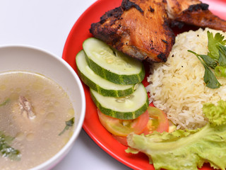 a set of a plate of chicken rice