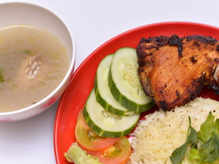 a set of a plate of chicken rice