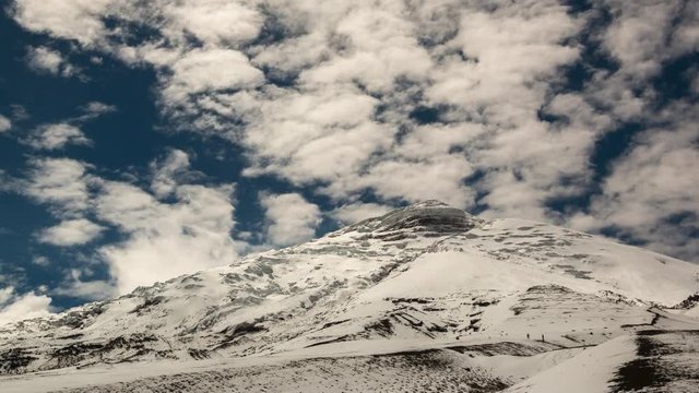 Cotopaxi Volcano after a heavy snowfall. Situated in the Ecuadorian Andes, at 5897m is one of the worlds highest volcanoes. Vapour is emanating from fumaroles near the summit.