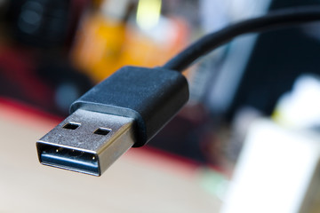 The connector of the USB cable is close-up.