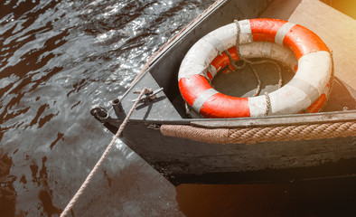 Close top view of boat gondola ship on river with rescue buoy through canal waters of Venice Italy. service of travel in city and making excursion for tourists from Russia in Czech Republic, Prague.  © Andrian